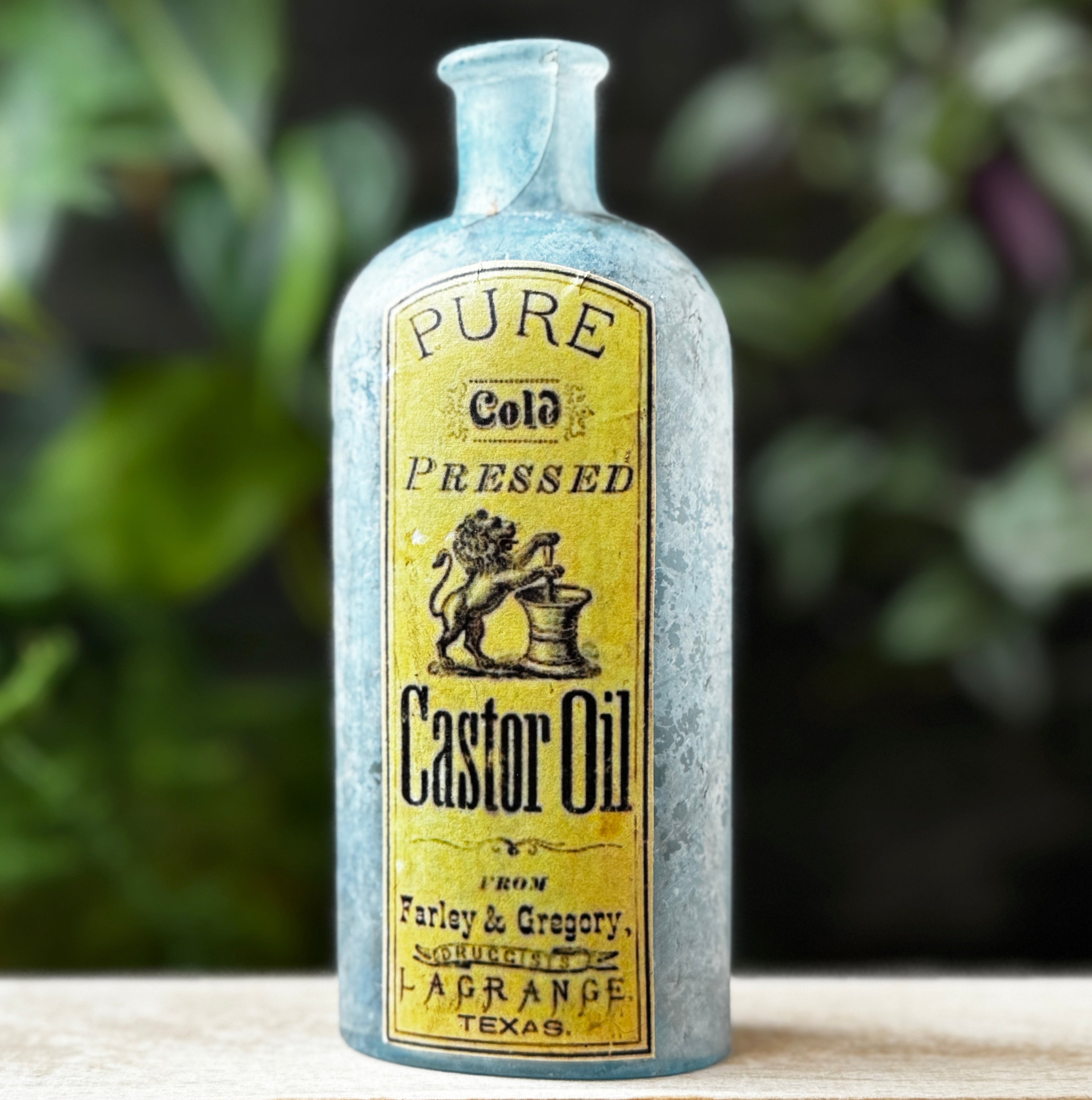 Antique glass bottle with Castor Oil label