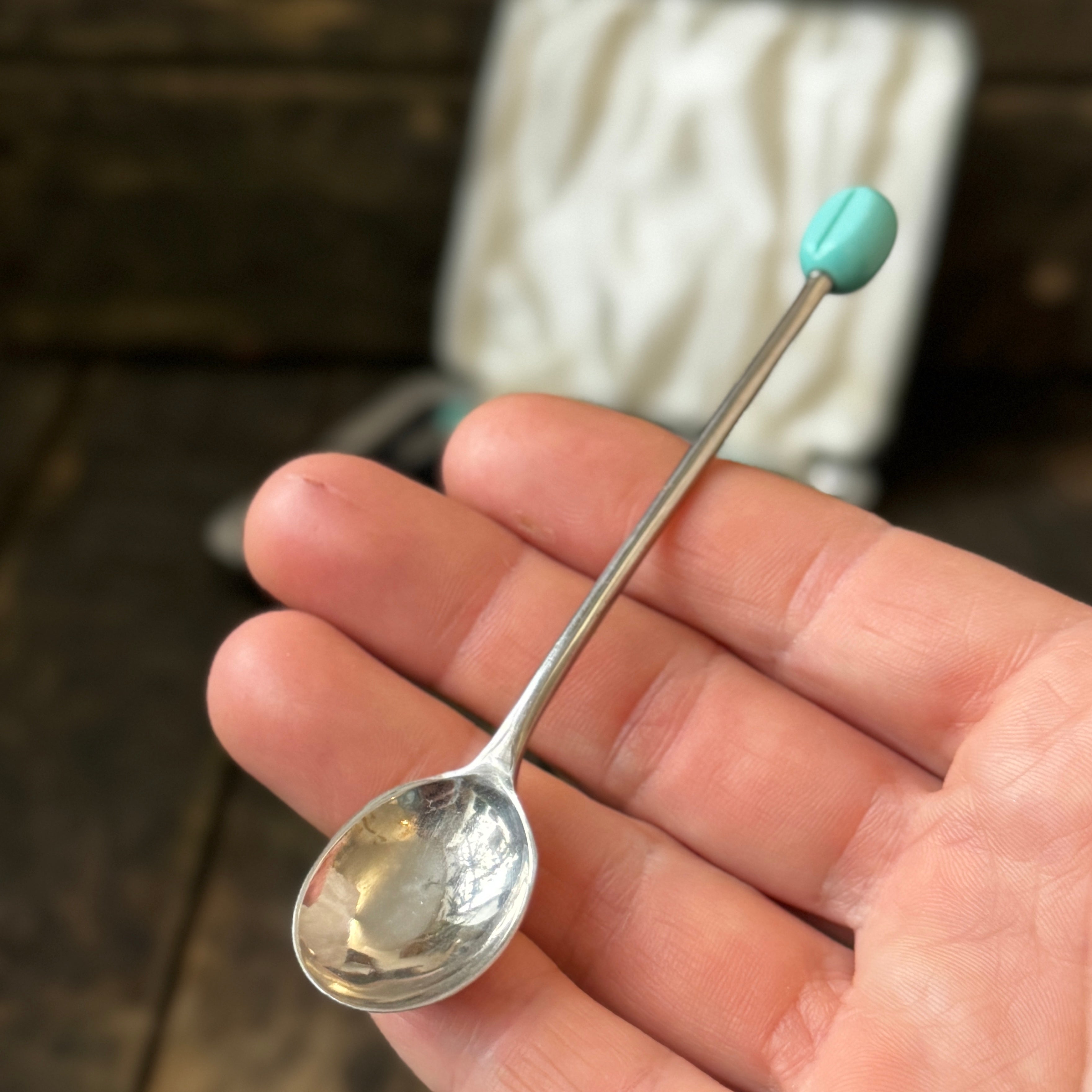 Mid-century coffee spoons with stylised turquoise espresso bean terminals