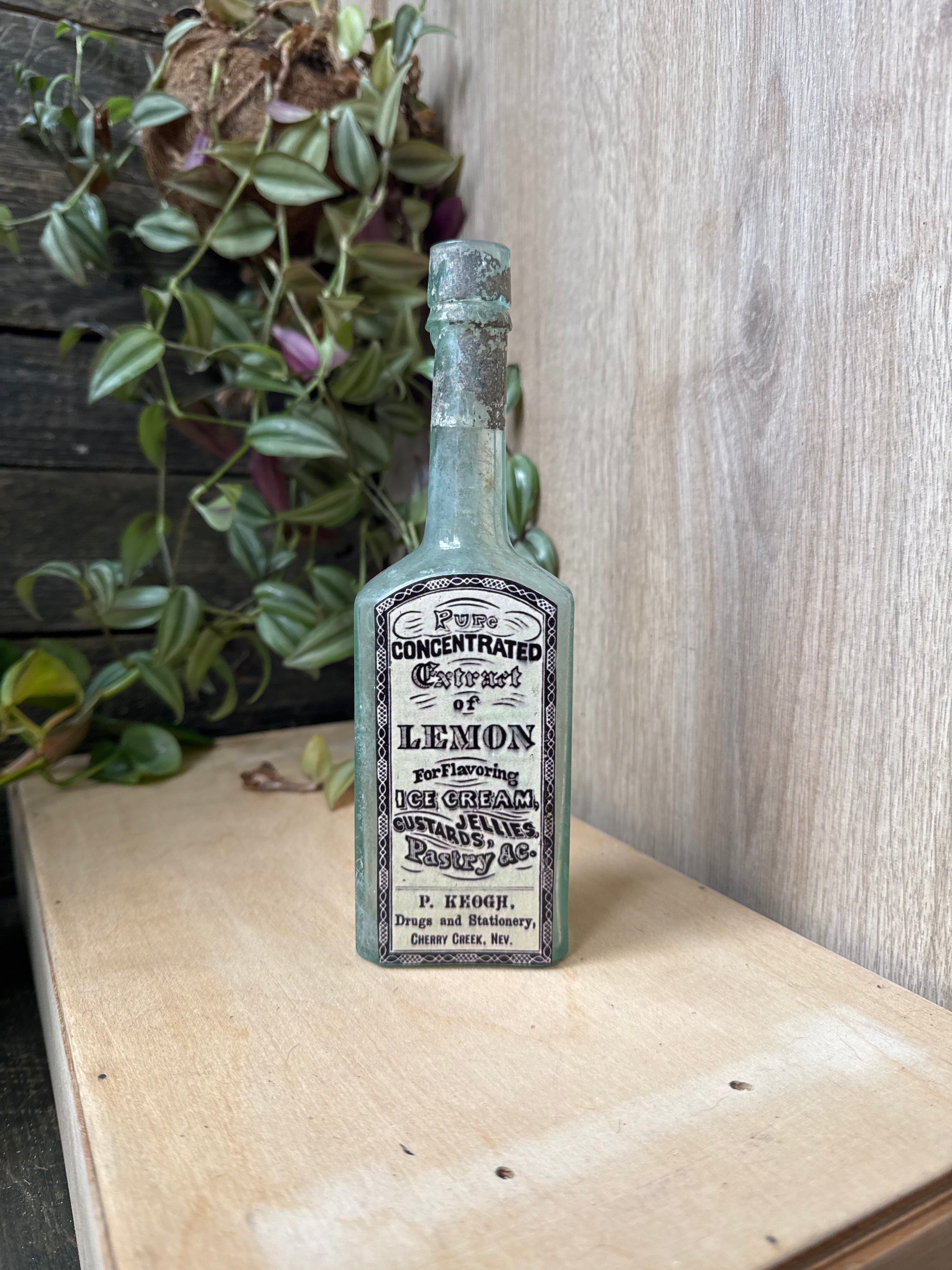 Antique early 20th century bottle with label