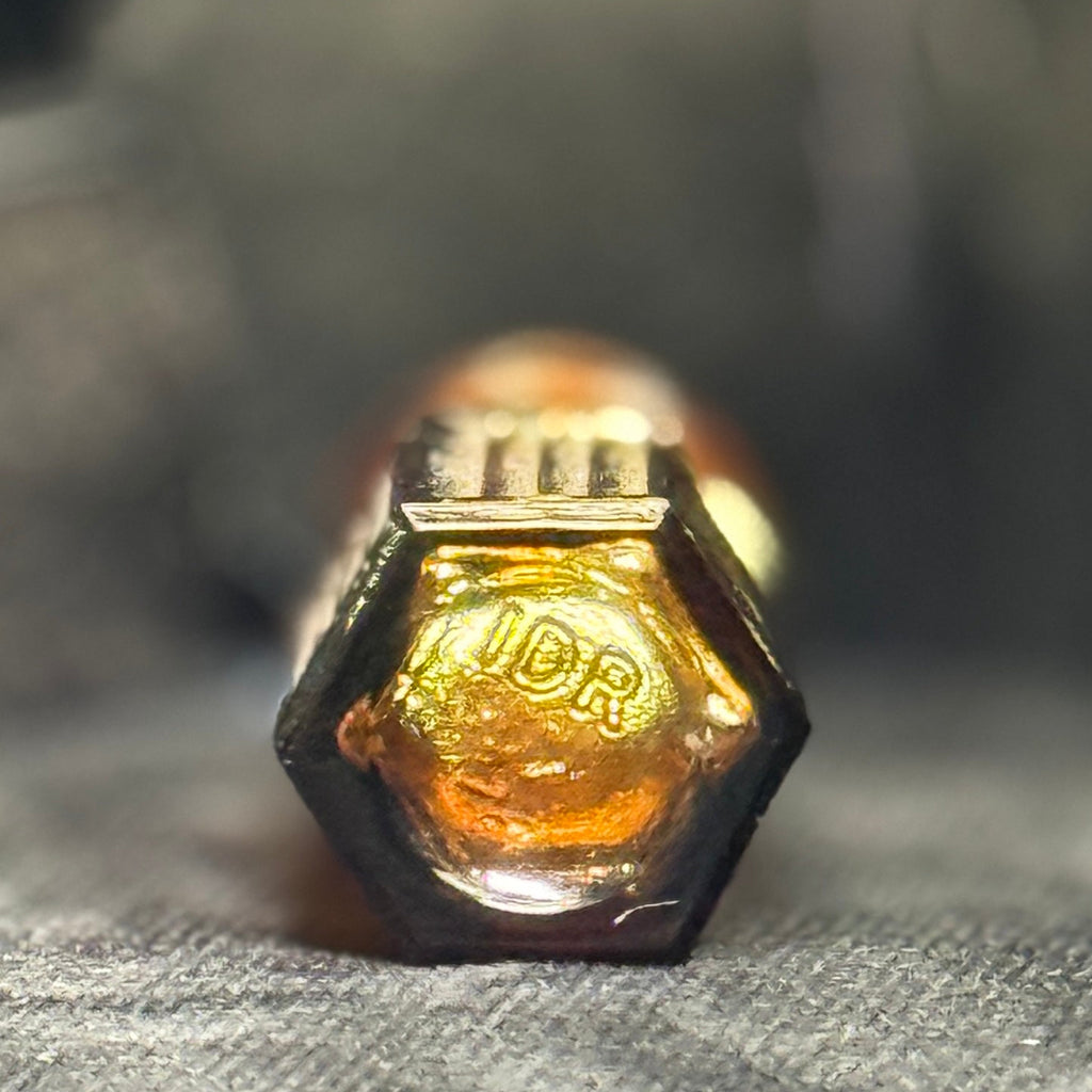 Tiny amber glass 1 dram apothecary bottle