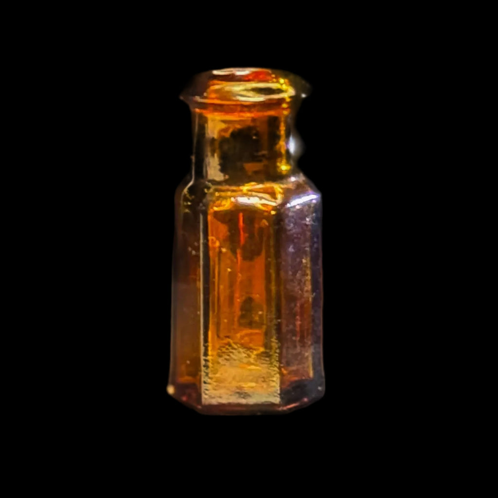 Tiny amber glass 1 dram apothecary bottle