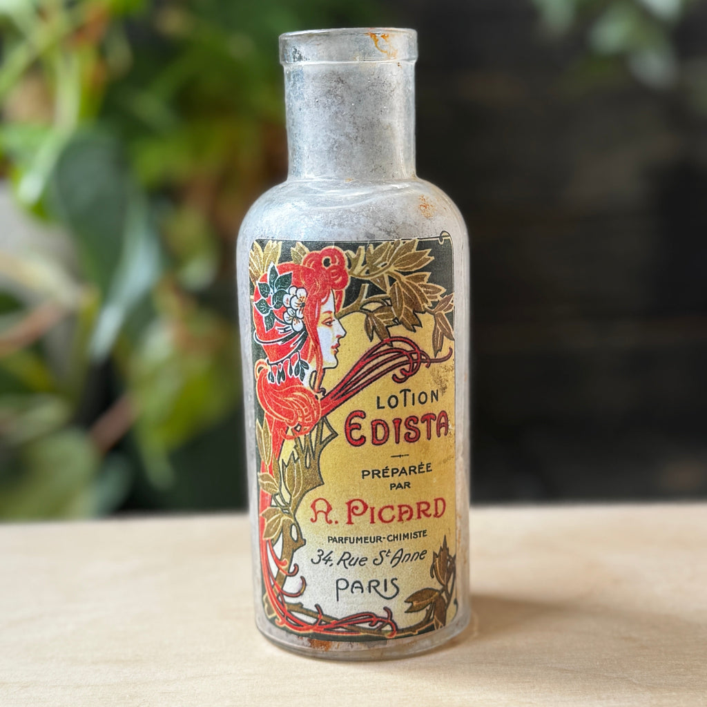 Antique bottle with Lotion Edista label