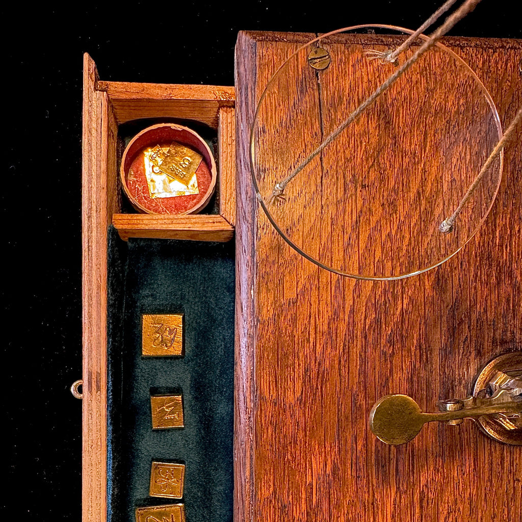 Set of antique apothecary scales in glass-fronted wooden case
