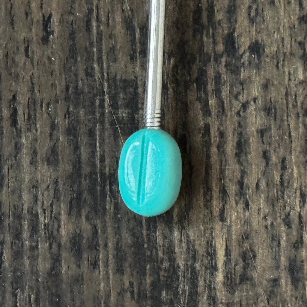 Mid-century coffee spoons with stylised turquoise espresso bean terminals
