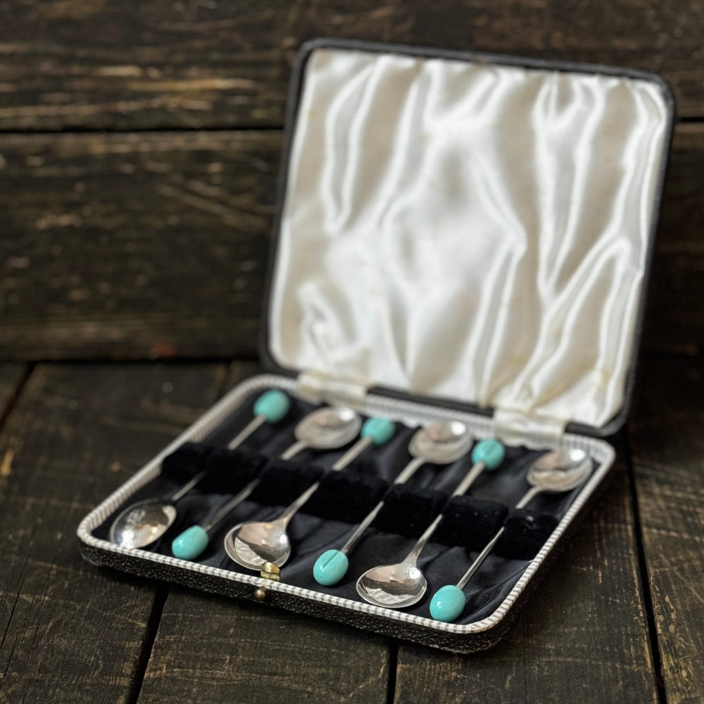 Mid-century coffee spoons with stylised turquoise espresso bean terminals