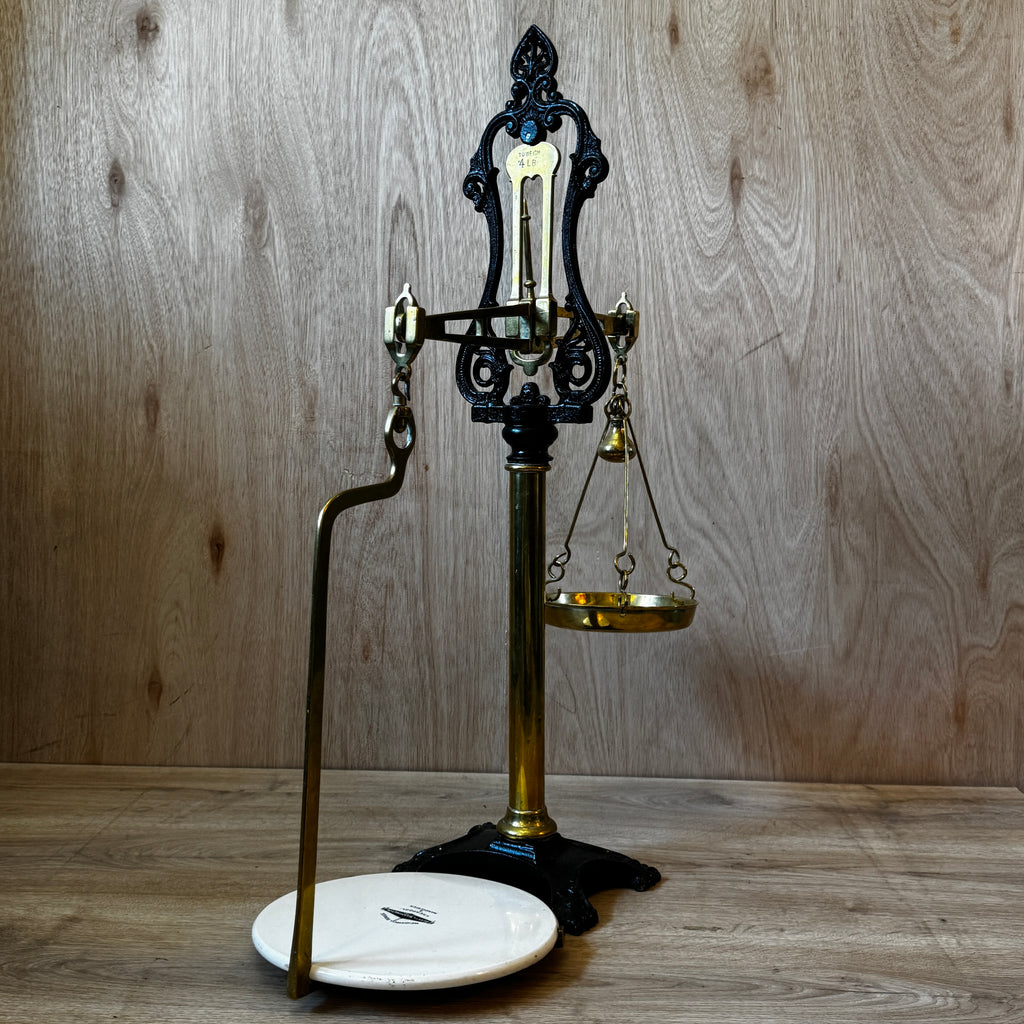 Very large, antique 1880s shop scales. Cast iron and brass with original ceramic weigh plate