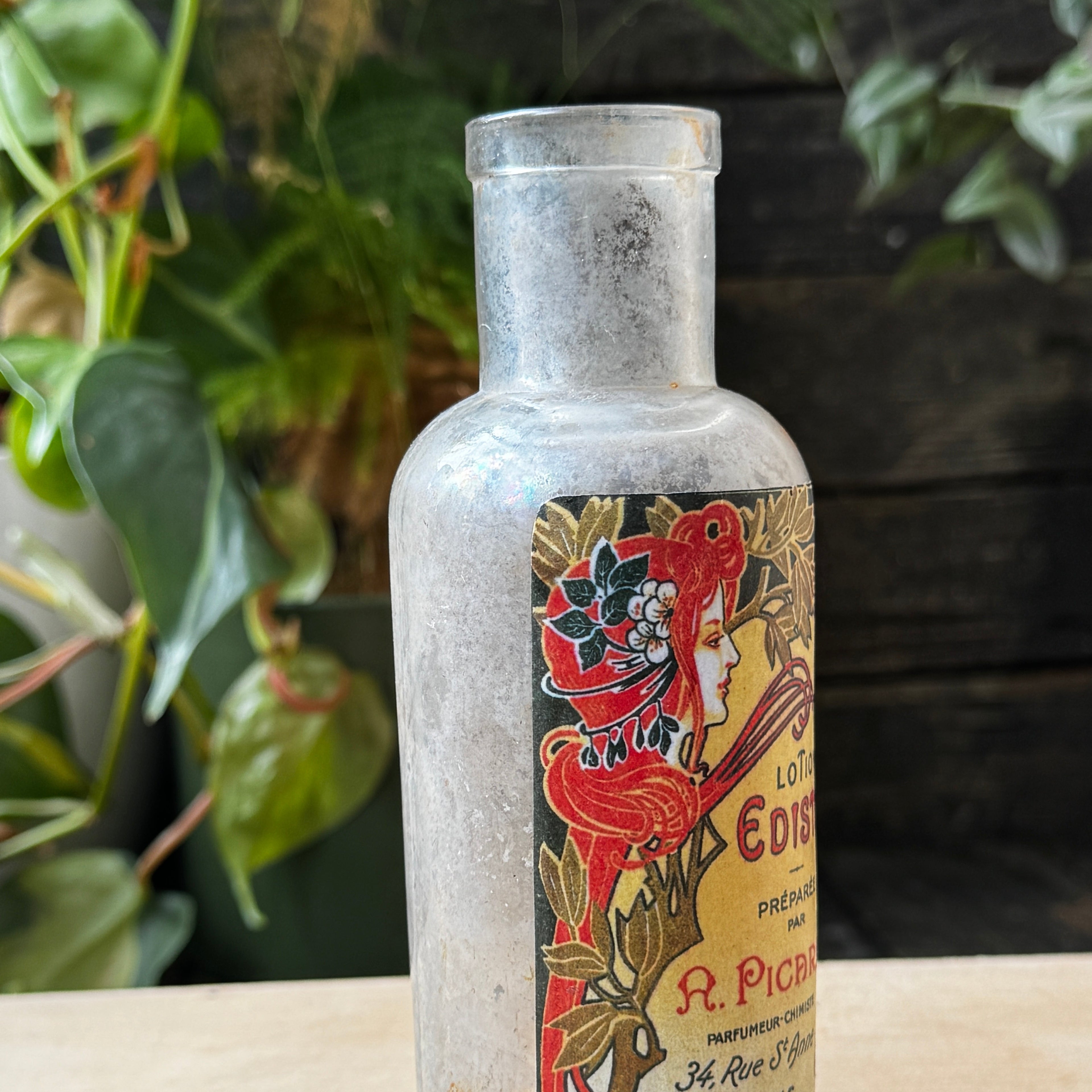 Antique bottle with Lotion Edista label