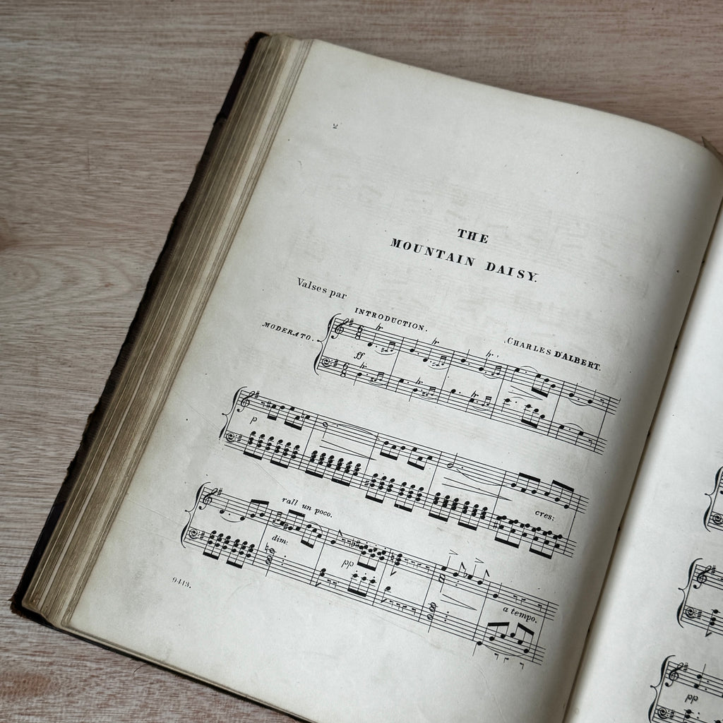 Set of two early-mid 19th century music books compiled by hand, with some notes in pen and pencil. Unique and personal, with gorgeous colour images and covers amongst the scores.