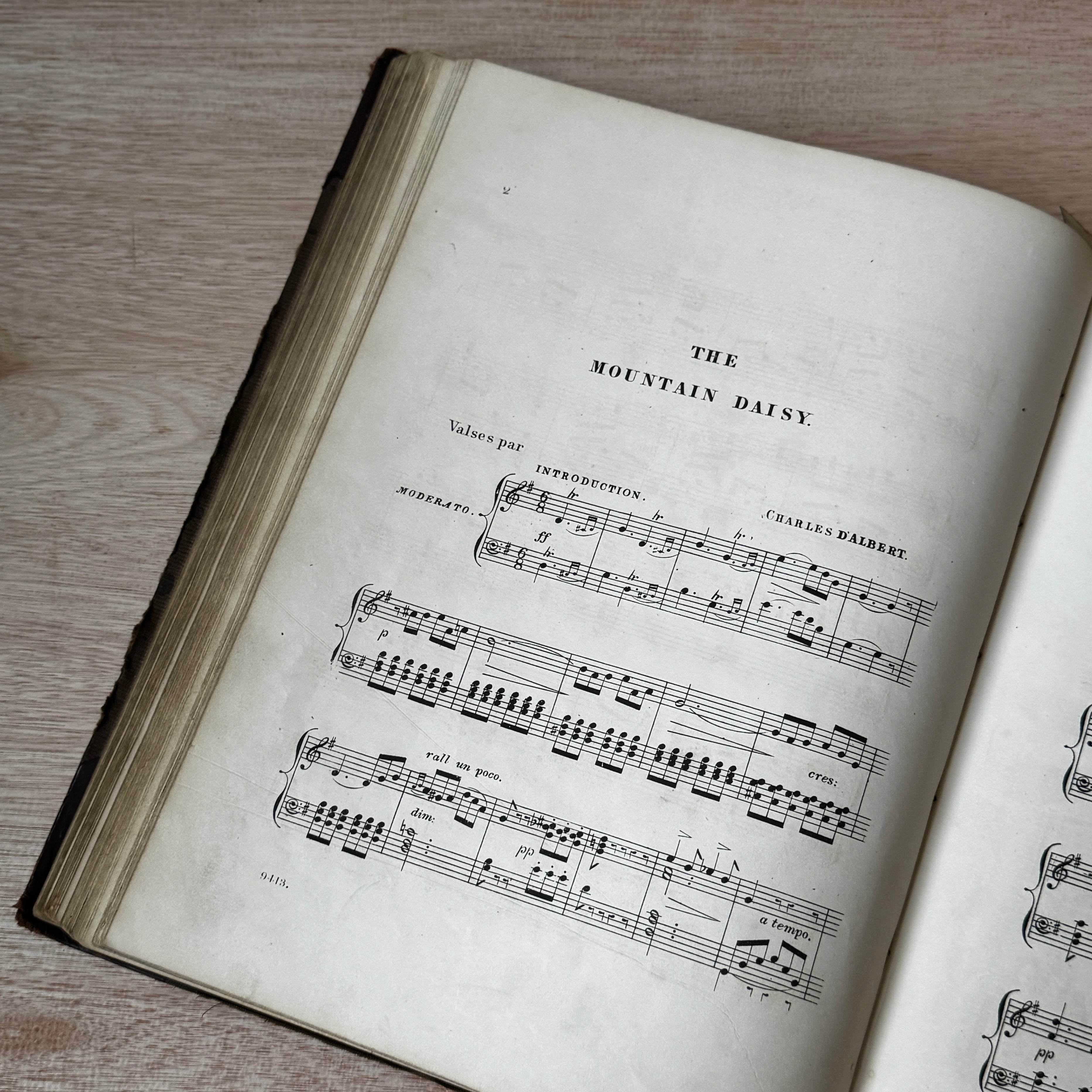 Set of two early-mid 19th century music books compiled by hand, with some notes in pen and pencil. Unique and personal, with gorgeous colour images and covers amongst the scores.