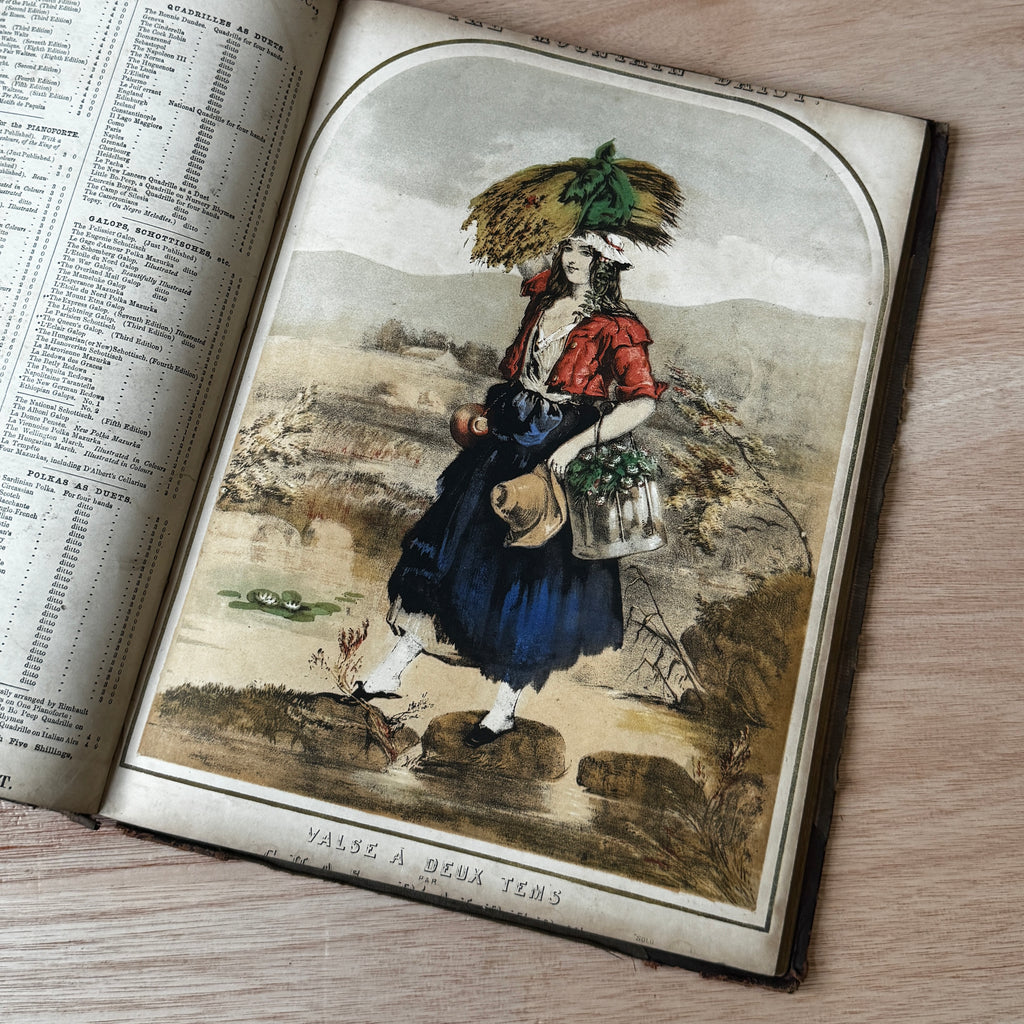 Set of two early-mid 19th century music books compiled by hand, with some notes in pen and pencil. Unique and personal, with gorgeous colour images and covers amongst the scores.