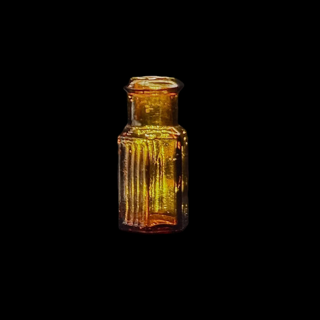 Tiny amber glass 1 dram apothecary bottle