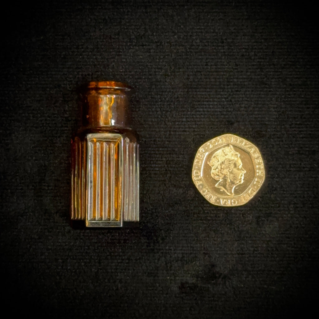 Tiny amber glass 1 dram apothecary bottle