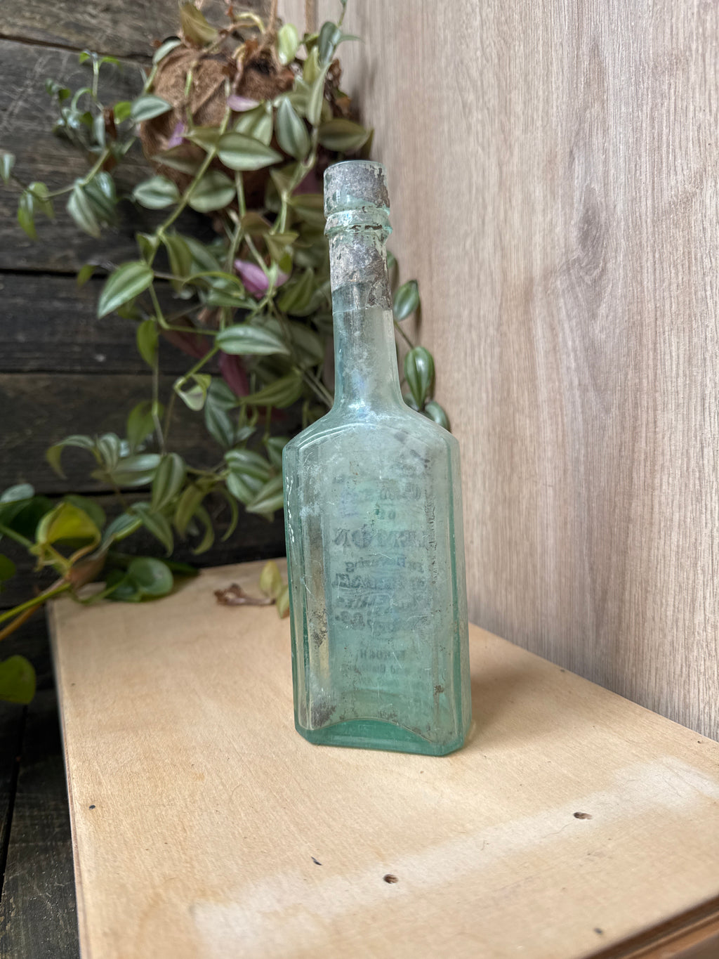 Antique early 20th century bottle with label