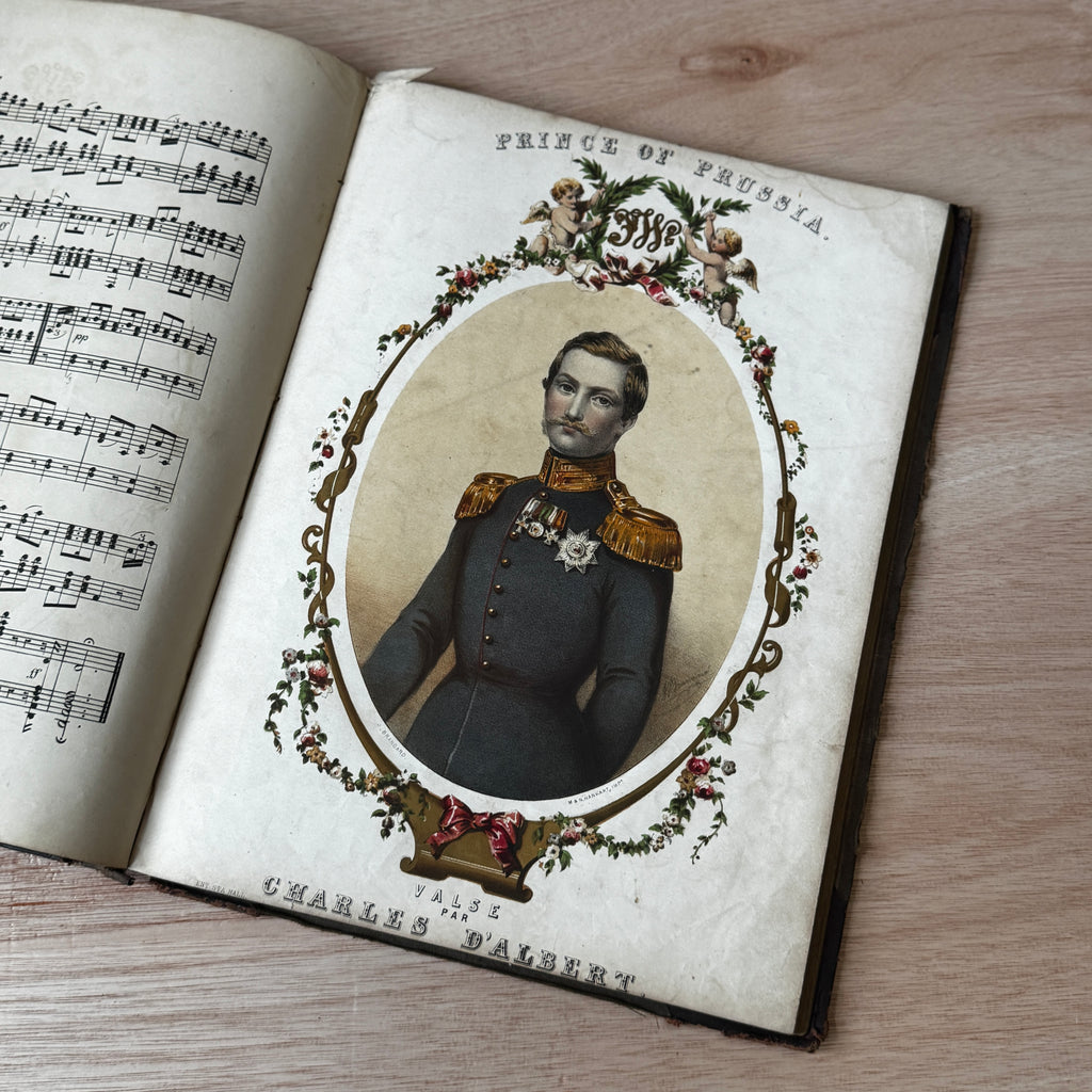 Set of two early-mid 19th century music books compiled by hand, with some notes in pen and pencil. Unique and personal, with gorgeous colour images and covers amongst the scores.