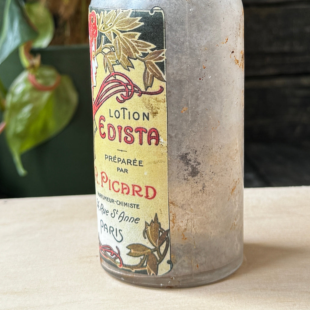 Antique bottle with Lotion Edista label