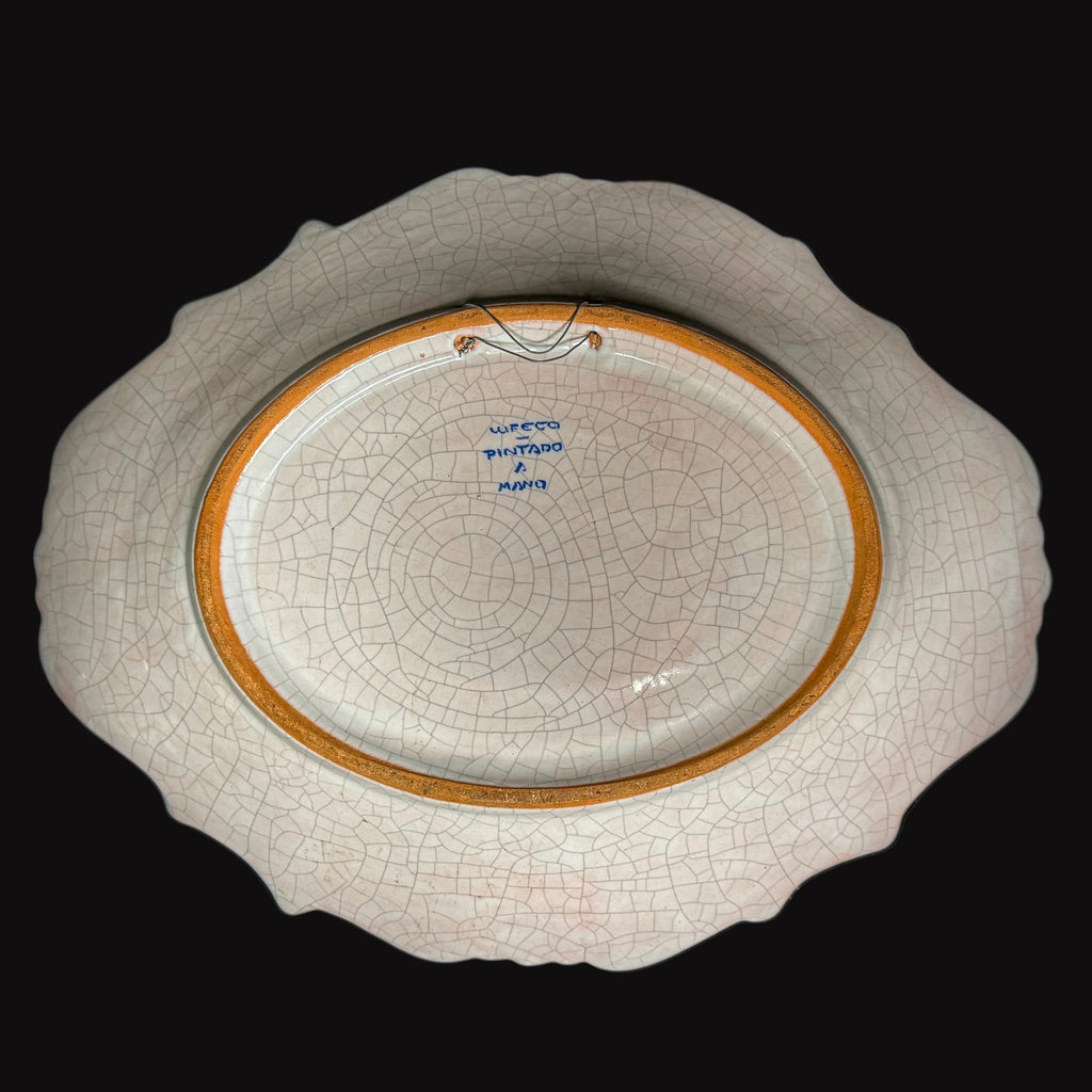 Hand-painted glazed plate of Spanish design