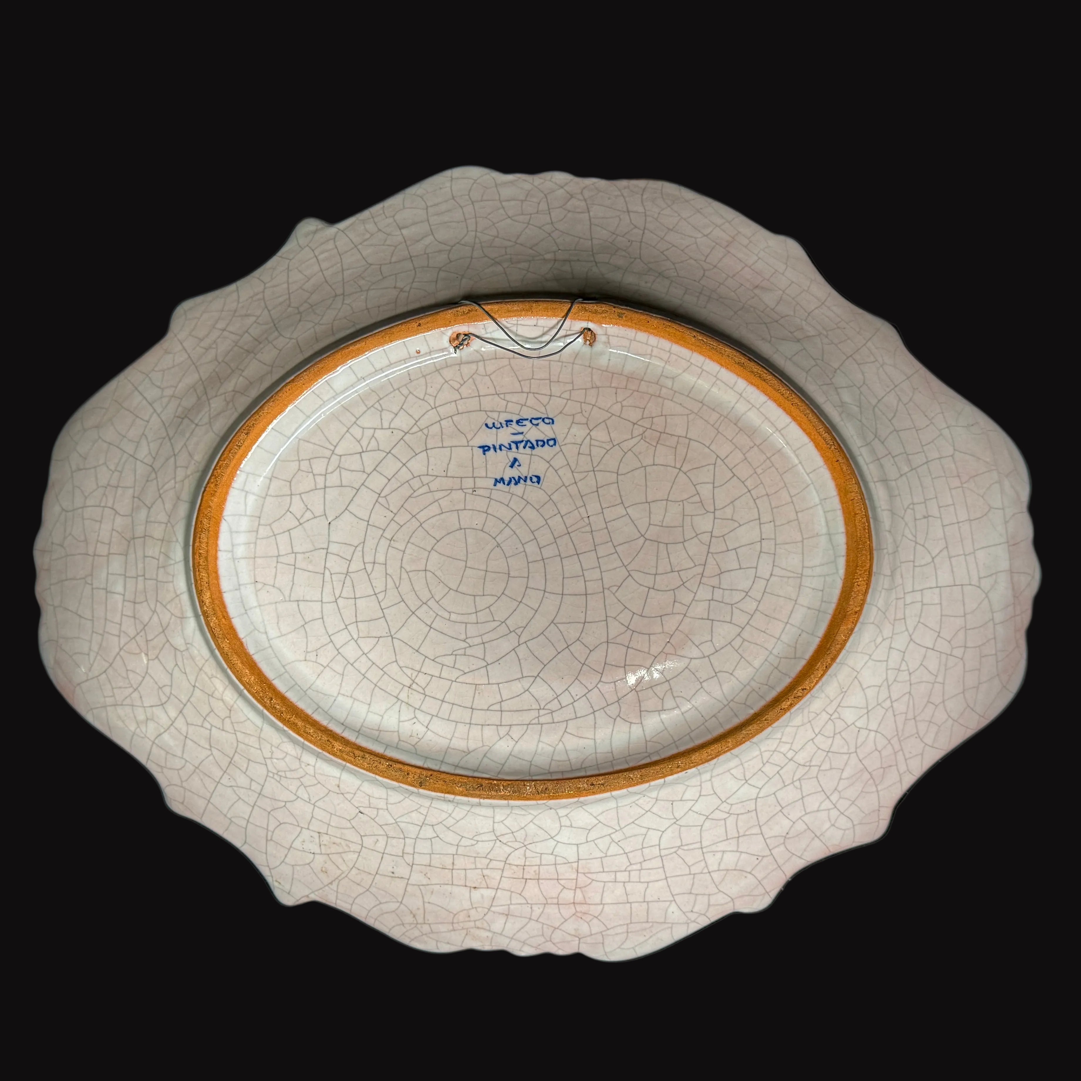 Hand-painted glazed plate of Spanish design